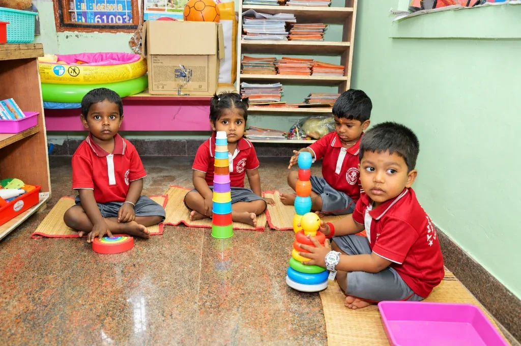 Playgroup children exploring Montessori learning materials